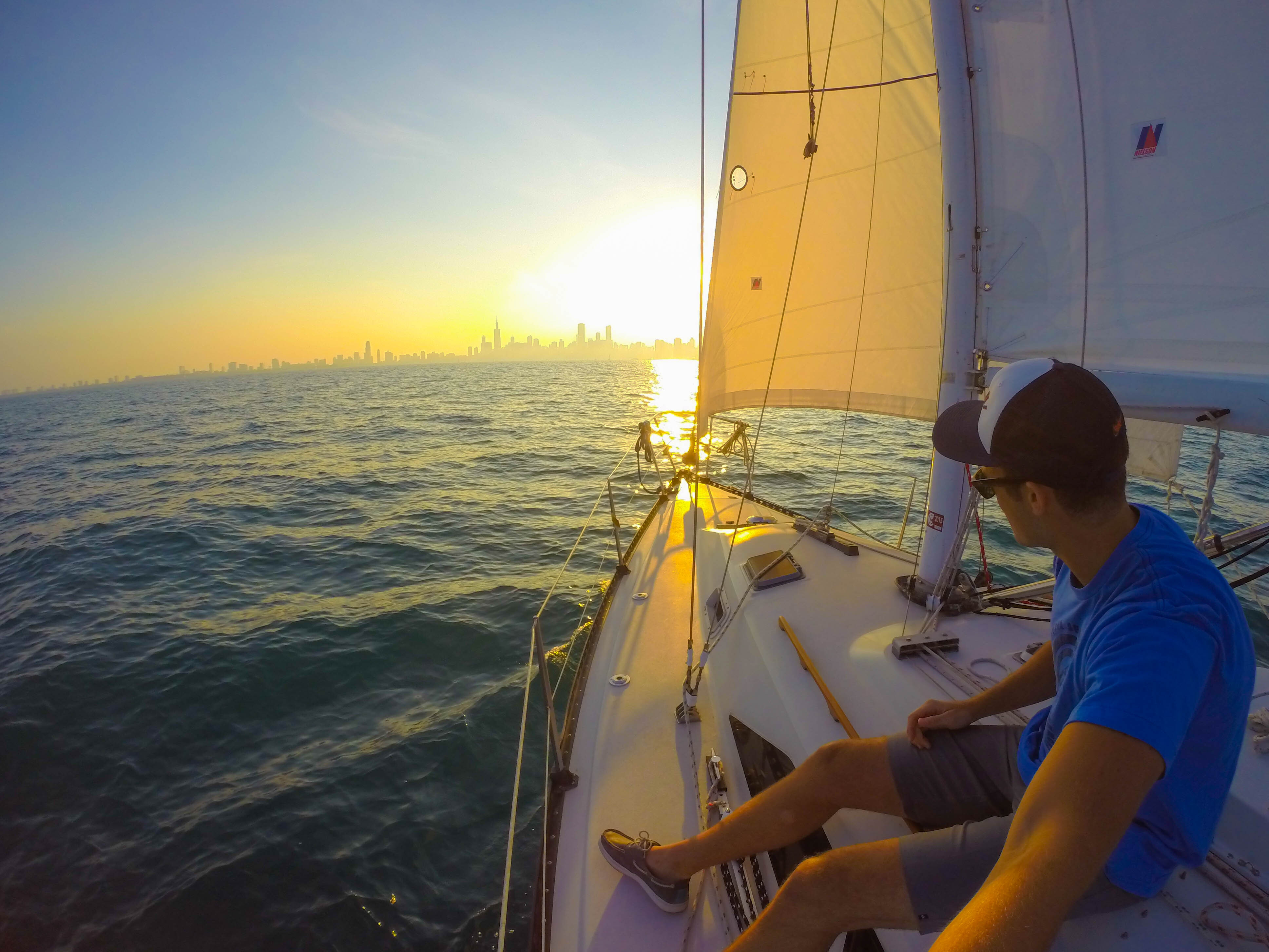Man sails his boat on Lake Michigan in Chicago.