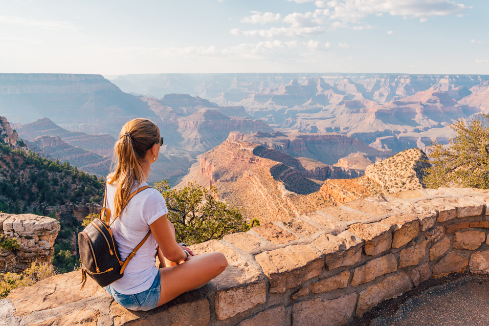 Beautiful girl exploring Grand Canyon national park in Arizona, USA.