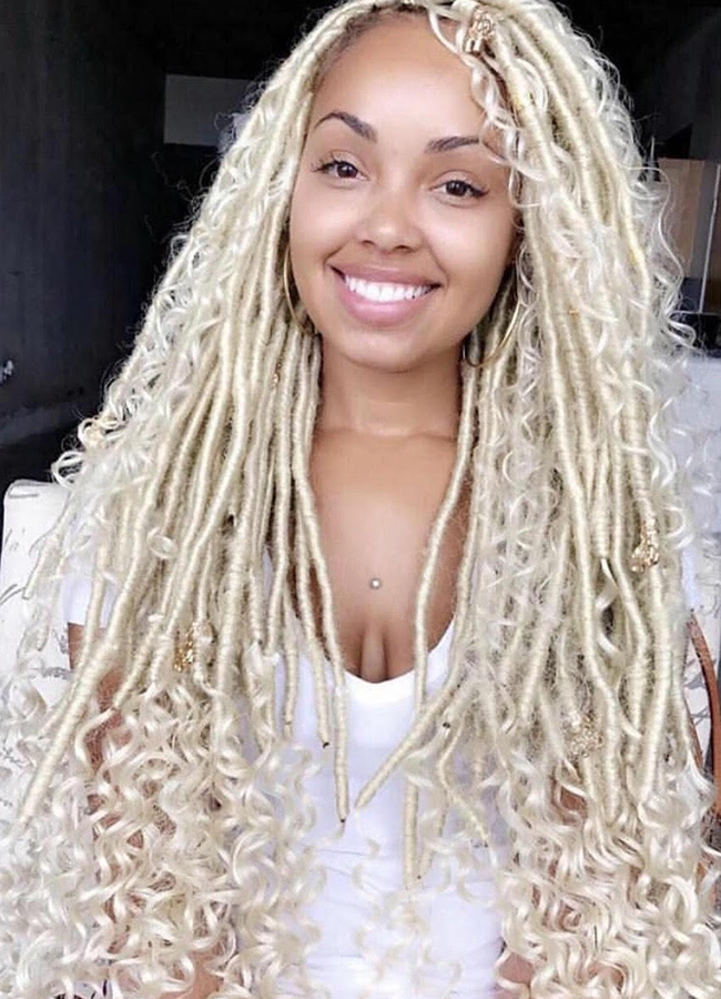 Woman smiling with blonde faux locs