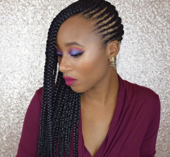 African-American woman with side swept braids