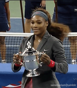 Serena Williams holding up Wimbledon Cup