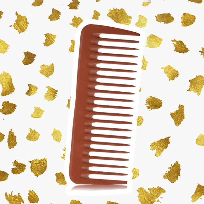 A brown wide-tooth Nubone comb